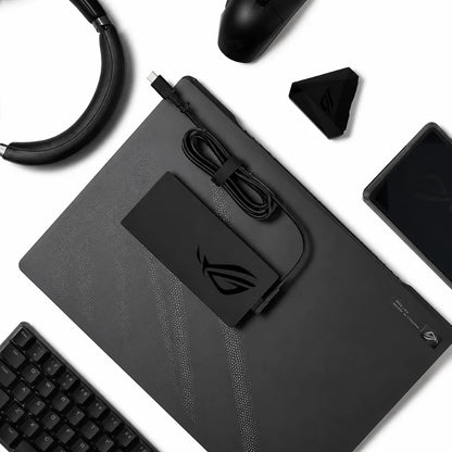 ASUS 280W rectangular USB pin laptop adapter placed on an ASUS ROG laptop with USB charging cable for compatible ASUS gaming and creator laptops.