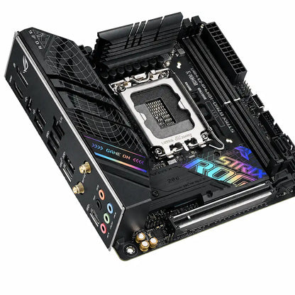 ASUS ROG STRIX B760-I GAMING WIFI D5 Mini-ITX motherboard angled view with Intel LGA1700 socket, PCIe slot, RGB heatsinks and WiFi support on white background.
