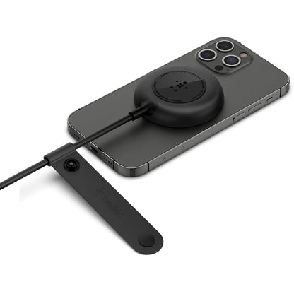 Belkin WIA005BTBK magnetic wireless charger securely attached to a compatible iPhone for wireless charging -tpstech.in