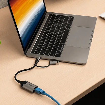 Cadyce CA-CU1000 USB to Gigabit Ethernet Adapter connected to a USB-C laptop with RJ45 cable for high-speed wired networking -tpstech.in