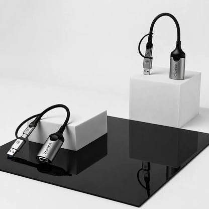 Cadyce CA-CU1000 USB-A and USB-C to Gigabit Ethernet Adapter with RJ45 LAN port displayed in a premium lifestyle setup for wired network connectivity -tpstech.in