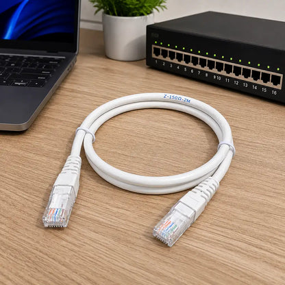 Cadyce CA-PC62M CAT6 UTP Patch Cord 2M 24 AWG Pure Copper Ethernet cable placed in a professional networking workspace with laptop and network switch -tpstech.in
