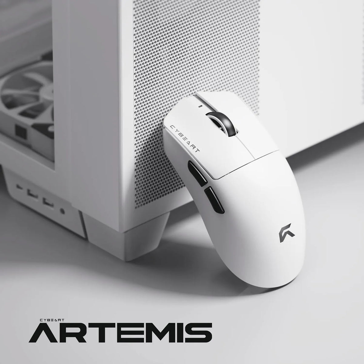 Cybeart Artemis 52g Ultra-Light Wireless Gaming Mouse - White resting next to a white desktop cabinet -tpstech.in