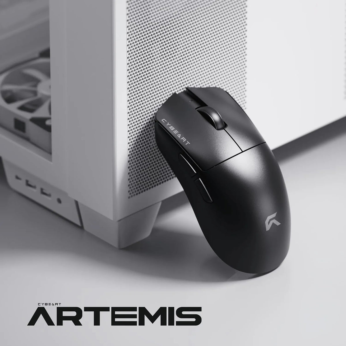 Cybeart Artemis 52g Ultra-Light Wireless Gaming Mouse resting beside a white PC gaming cabinet -tpstech.in