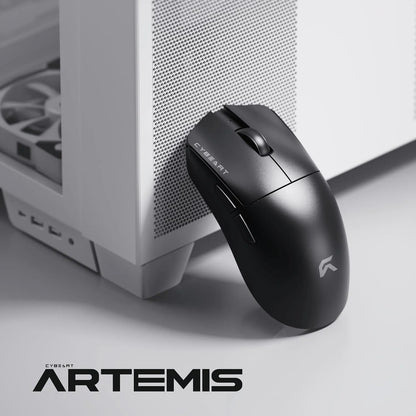 Cybeart Artemis 52g Ultra-Light Wireless Gaming Mouse resting beside a white PC gaming cabinet -tpstech.in