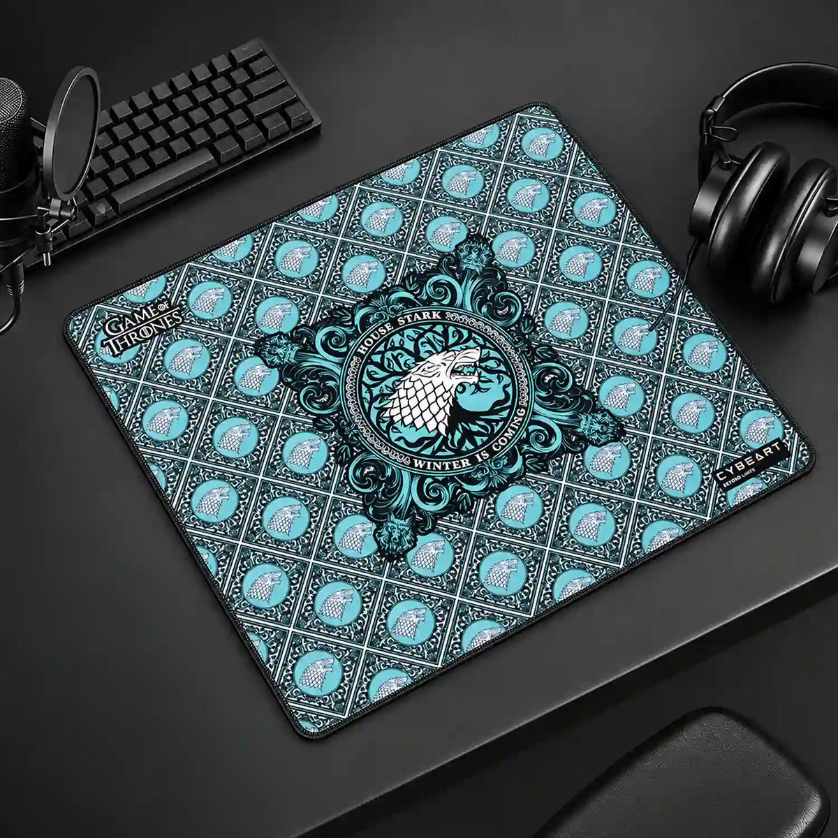 Cybeart House Stark Large Gaming Mouse Pad with Waterproof Surface placed on gaming desk setup with keyboard and headphones -tpstech.in