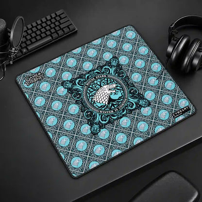 Cybeart House Stark Large Gaming Mouse Pad with Waterproof Surface placed on gaming desk setup with keyboard and headphones -tpstech.in