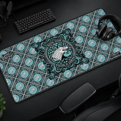 Cybeart House Stark XXL Gaming Desk Mat Waterproof placed on gaming desk setup with keyboard and headphones -tpstech.in