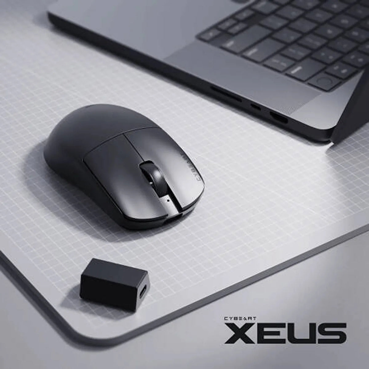 Cybeart Xeus Ultra-Light Wireless Gaming Mouse 8K Tri-Mode on desk mat beside laptop and 8K wireless dongle receiver -tpstech.in