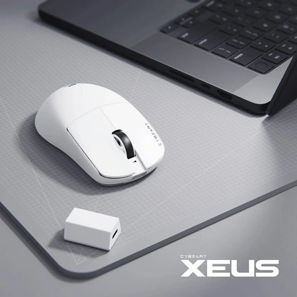 Cybeart Xeus Ultra-Light Wireless Gaming Mouse (White) beside a sleek laptop with white 8K dongle receiver -tpstech.in