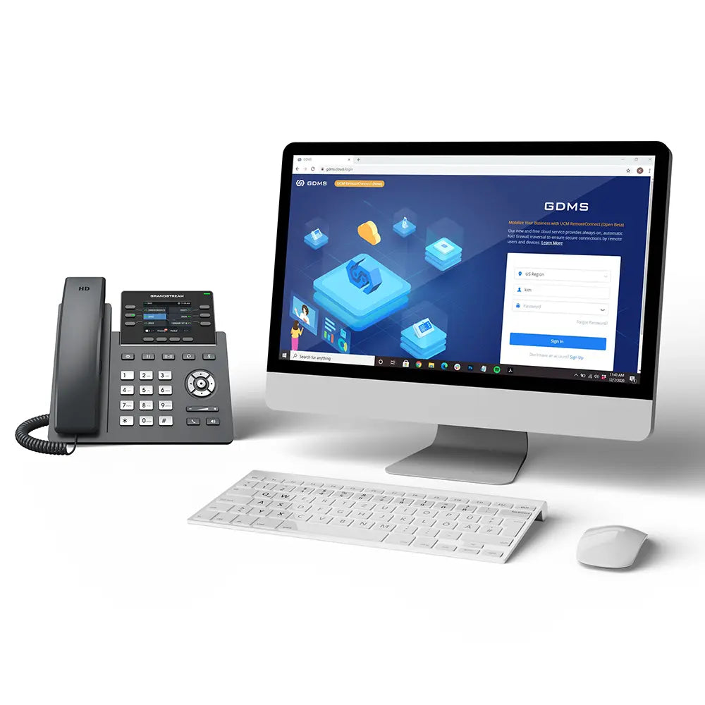 Grandstream GRP2613W IP phone with GDMS cloud device management platform displayed on desktop computer for centralized deployment.