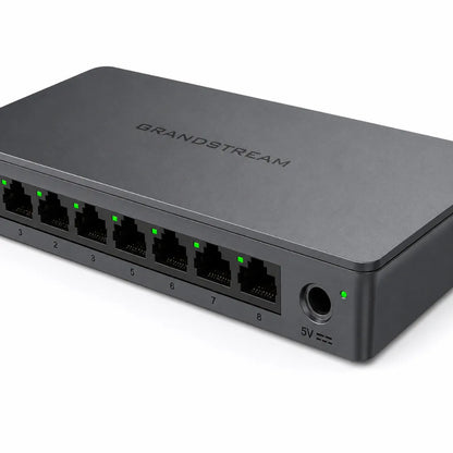 Close-up of Grandstream GWN7711 managed Gigabit switch showing RJ45 Ethernet ports and power input.
