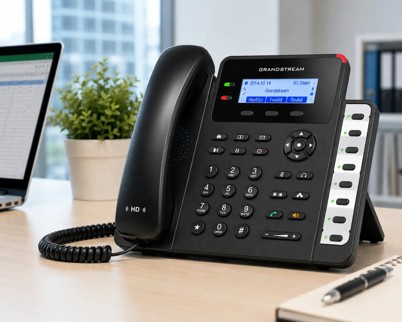 Grandstream GXP1628 business VoIP phone with HD audio and programmable keys positioned in a professional office workspace.