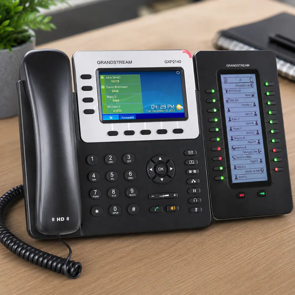 Grandstream GXP2200 EXT business phone expansion module paired with GXP2140 desk phone for enterprise communication.