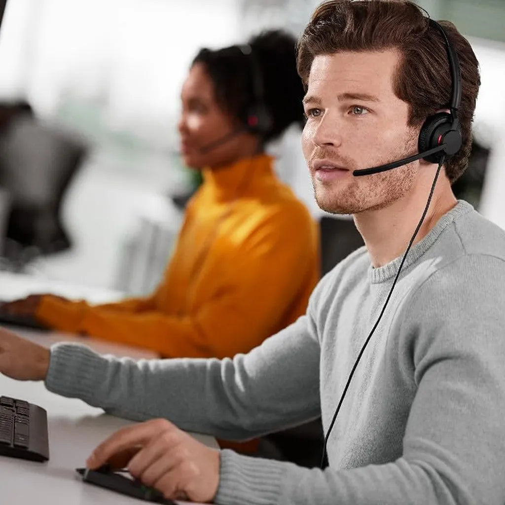 Professional using Jabra Engage 50 II Link MS Duo Wired Headset with USB-A and USB-C Connectivity in office environment -tpstech.in