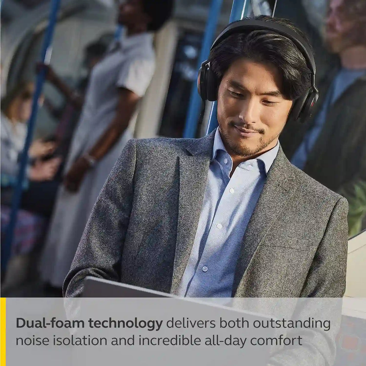 Commuter working on laptop in transit wearing Jabra Evolve2 75 headset with comfortable dual foam noise isolation -tpstech.in