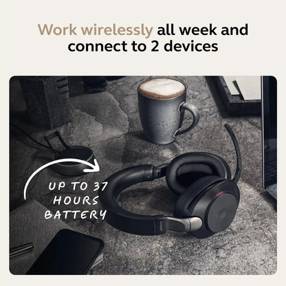 Jabra Evolve2 85 MS Stereo Wireless Headset on desk showing up to 37 hours battery life and charging stand -tpstech.in