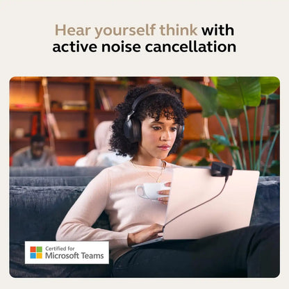 Woman working on laptop wearing Microsoft Teams certified Jabra Evolve2 85 headset with active noise cancellation -tpstech.in