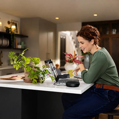 Professional using Jabra Speak2 75 UC Wireless Bluetooth Speakerphone with 4 noise-cancelling mics for home office calls -tpstech.in