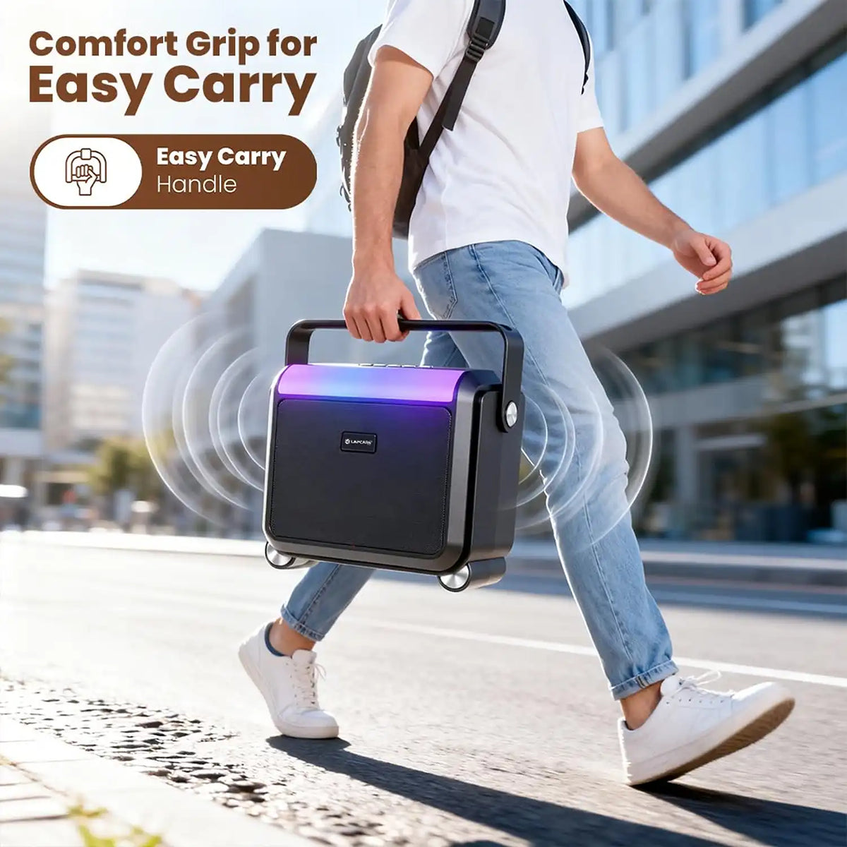 Man carrying Lapcare Aster 20W portable Bluetooth party speaker using the comfort grip handle -tpstech.in