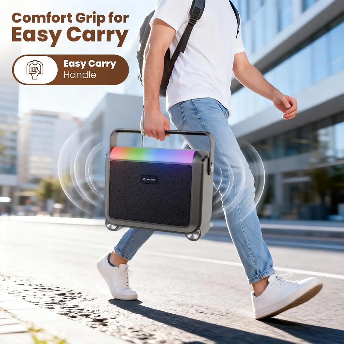 Person carrying Lapcare Aster LBS-201 20W portable Bluetooth speaker with comfort grip handle outdoors -tpstech.in
