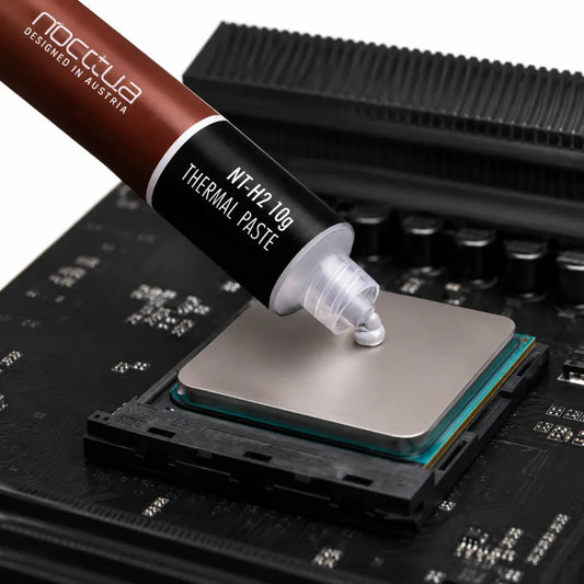 Noctua NT-H2 10g thermal paste being applied to a desktop CPU processor for high-performance heat transfer and efficient CPU cooling.