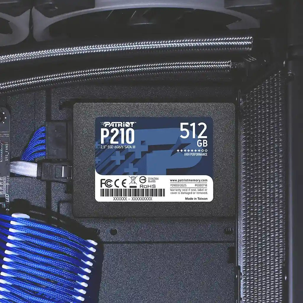 Patriot P210 512GB 2.5 Inch SATA III Internal SSD mounted inside desktop PC chassis drive bracket with blue cables -tpstech.in