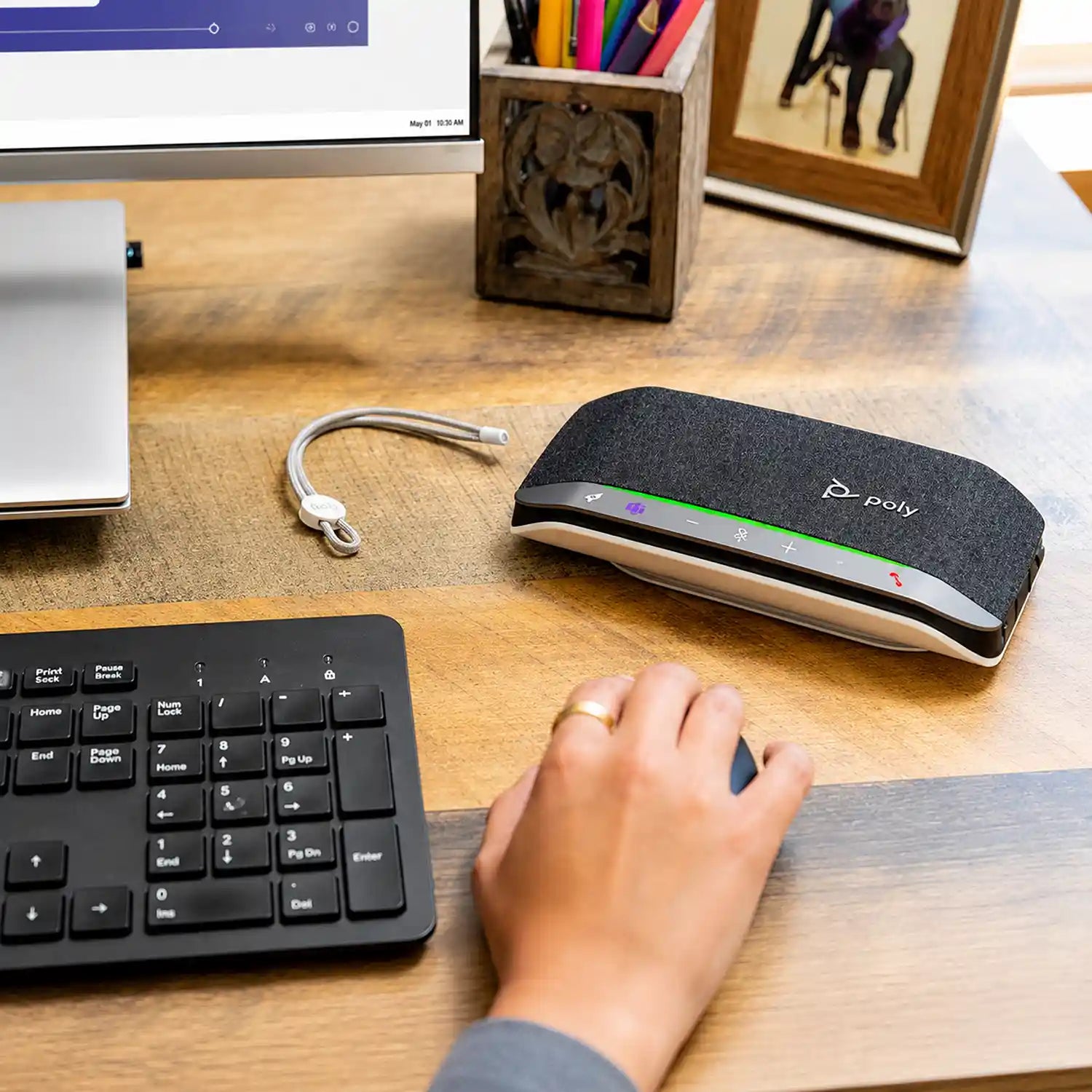 Poly Sync 20-M speakerphone in a desktop workspace for remote meetings and professional communication-tpstech.in