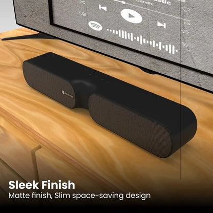 Portronics Decibel 20 POR 1734 16W portable soundbar with sleek matte finish placed on a TV wooden cabinet -tpstech.in