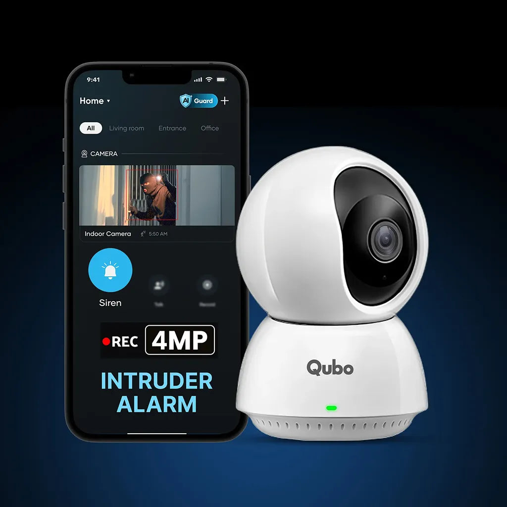 Qubo Smart Camera 360 Pro 4MP indoor security camera next to mobile phone showing live alert and siren trigger-tpstech.in