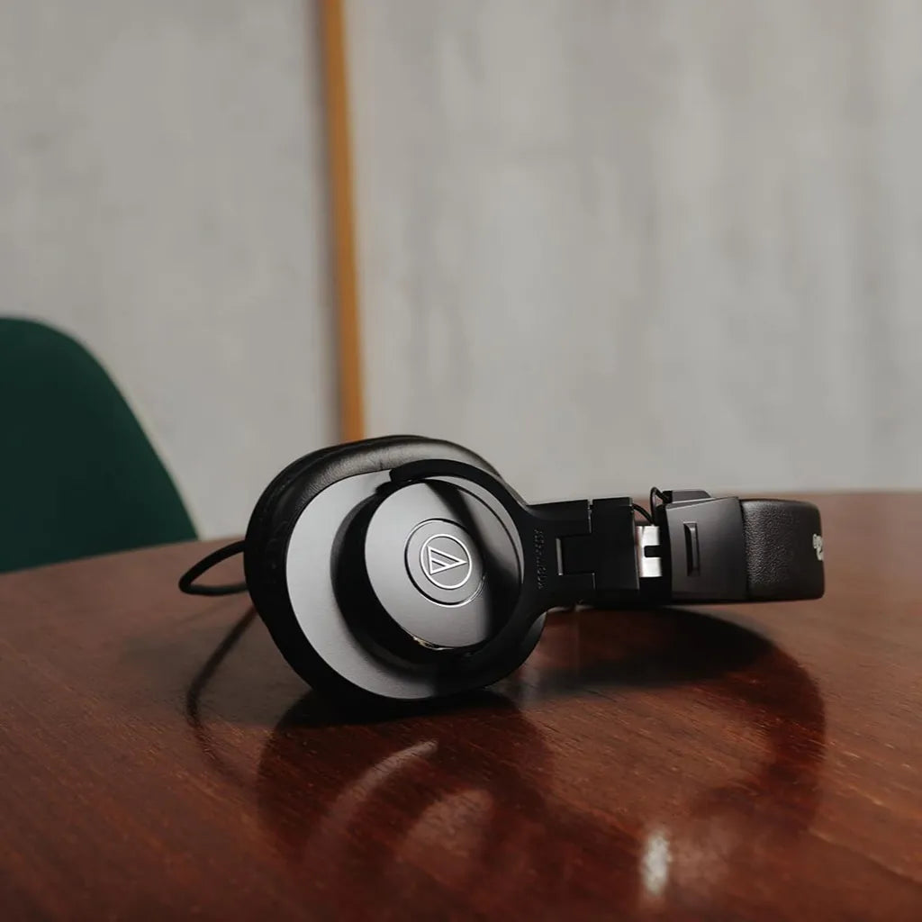 Repacked Audio-Technica ATH-M30x Professional Studio Monitor Headphones Resting on Wooden Desk -tpstech.in