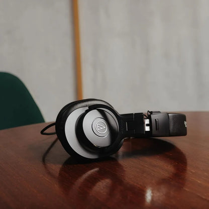 Repacked Audio-Technica ATH-M30x Professional Studio Monitor Headphones Resting on Wooden Desk -tpstech.in