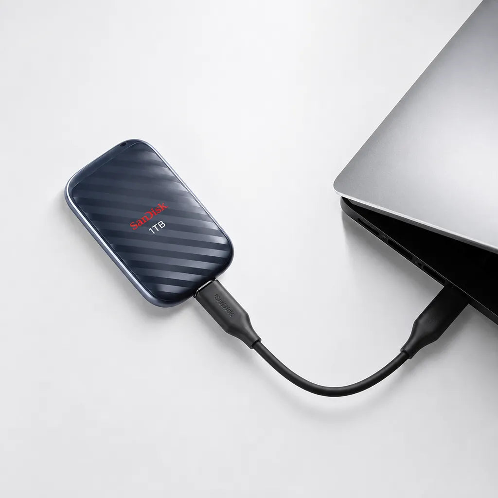 SanDisk SDSSDE10 1TB portable SSD connected to a laptop with USB cable for portable external storage -tpstech.in