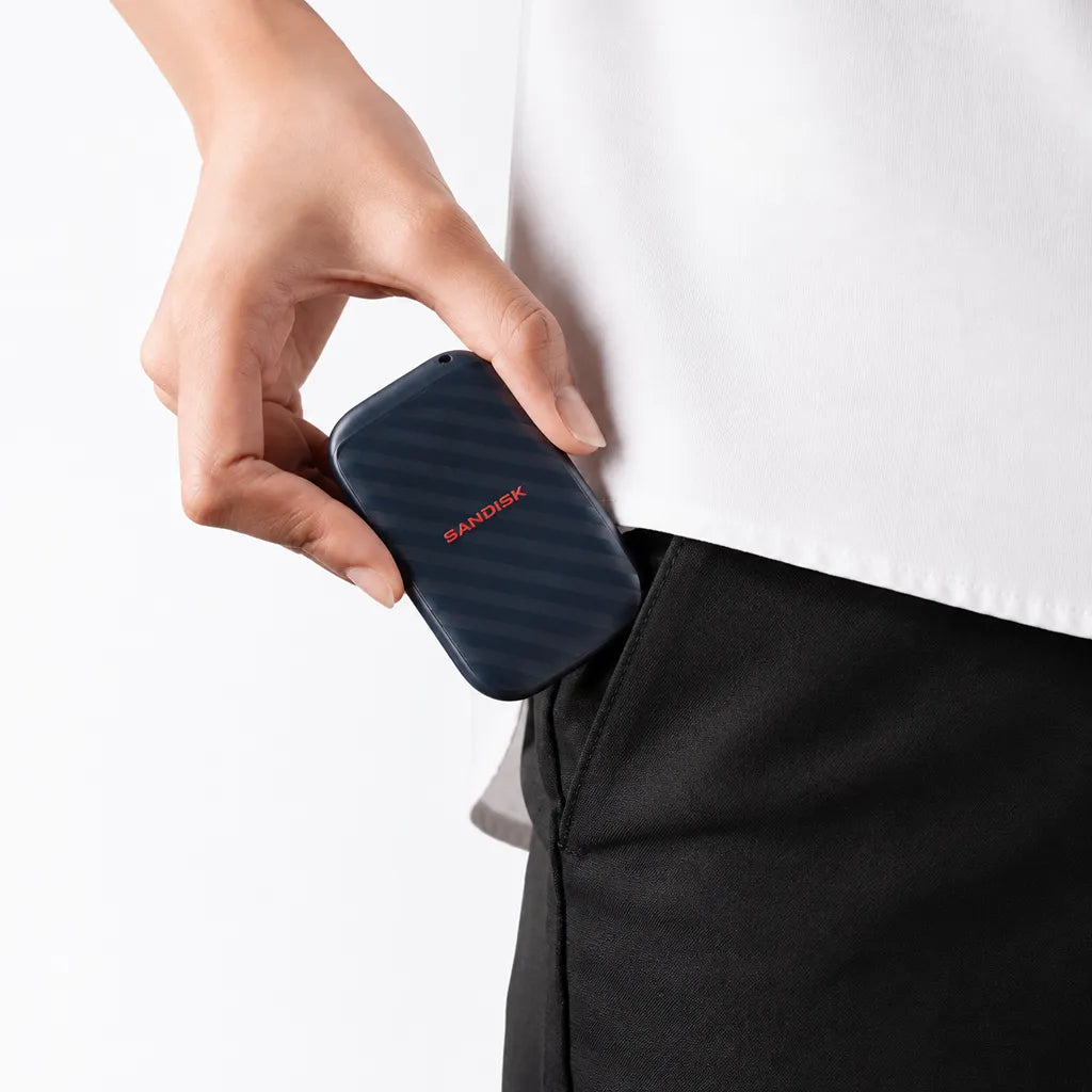 SanDisk SDSSDE10 1TB portable SSD shown being carried in a pocket for convenient portable storage -tpstech.in