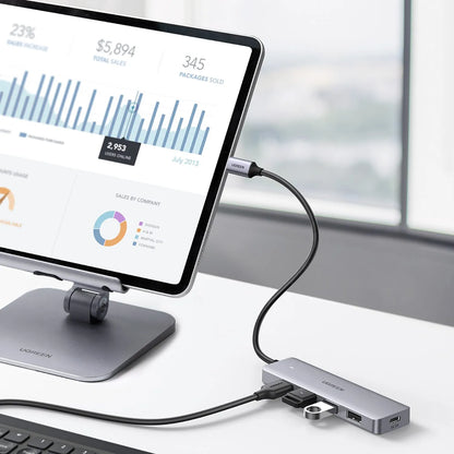 UGREEN CM219 4-in-1 USB-C Hub with 5Gbps Data Transfer Connected to Tablet on Desktop Stand tpstech.in