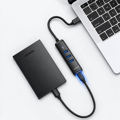 UGREEN CM416 80657 USB 3.0 4-Port Hub 5Gbps High-Speed Data Connected to Laptop and External Hard Drive tpstech.in
