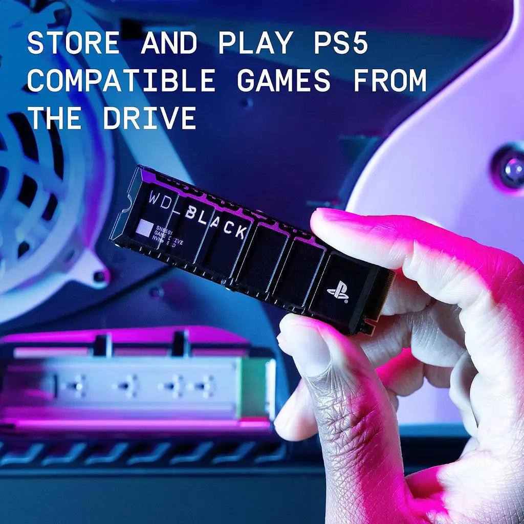 Holding WD BLACK SN850P 4TB NVMe SSD over open PS5 console expansion bay for game storage -tpstech.in