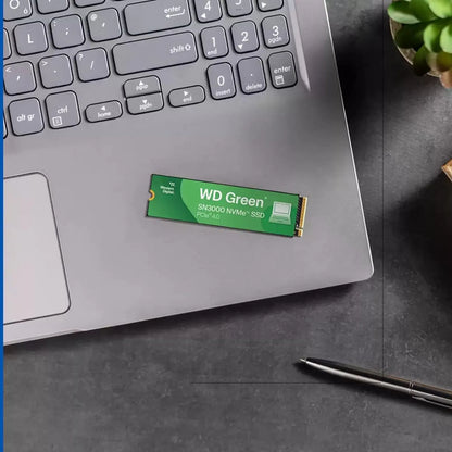 WD Green SN3000 1TB NVMe SSD PCIe Gen4 M.2 2280 Internal SSD placed on a laptop palm rest -tpstech.in