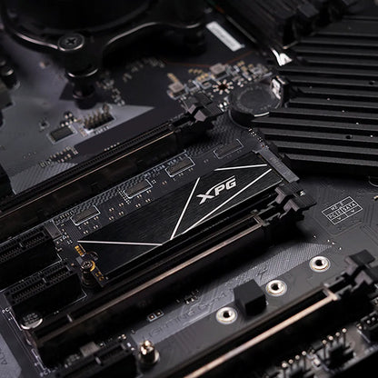 Close-up of XPG GAMMIX S70 Blade 8TB PCIe Gen4 NVMe M.2 2280 SSD installed on a gaming motherboard.
