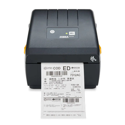 Zebra ZD230 Monochrome Thermal Transfer Desktop Barcode Printer dispensing a printed shipping barcode label -tpstech.in